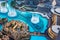 Dubai, United Arab Emirates - July 5, 2019: Dubai mall fountain show surrounded and modern downtown buildings top view