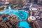 Dubai, United Arab Emirates - July 5, 2019: Dubai mall fountain show surrounded and modern downtown buildings top view