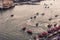 Dubai, United Arab Emirates - June 4, 2019: Boats on Dubai creek in Deira with the view of old Dubai in United Arab Emirates