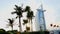 DUBAI, UNITED ARAB EMIRATES, UAE - NOVEMBER 20, 2017: Hotel Burj al Arab , at sunset, palms are seen, flags are