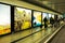 Dublin Airport people, passengers travelling with suitcases on walkway escalator in motion with highlighted images of Ireland in t