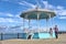 Dublin, Ireland - September 13, 2020: Random people walking at East Pier Dun Laoghaire harbor on a lovely sunny morning. Blue