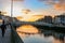 Dublin night scene with Ha`penny bridge and Liffey river lights