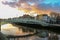 Dublin night scene with Ha`penny bridge and Liffey river lights