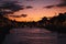 Dublin`s cityscape during a colorful sunset with clouds and seagulls over Liffey river