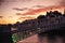 Dublin`s cityscape during a colorful sunset with clouds and seagulls over Liffey river