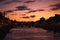 Dublin`s cityscape during a colorful sunset with clouds and seagulls over Liffey river