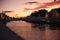 Dublin`s cityscape during a colorful sunset with clouds and seagulls over Liffey river