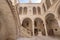 Dubrovnik, Croatia - Aug 22, 2020: Atrium stairs with bronze statue inside Rector's Palace in old town