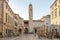 Dubrovnik, Croatia - Aug 22, 2020: Bell tower view from empty stradun street in old town morning sunrise