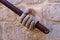 Dubrovnik, Croatia - Jun 21, 2020: Stone hand holding stairway railing in the Rectors Palace in Dubrovnik, Croatia