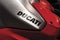 Ducati brand name is on a shiny metallic sports bike