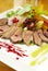 Duck breast with glazed pear and berry sauce