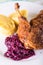 Duck breast with red cabbage and crispy skin and dumplings