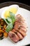 Duck breasts with sour mango sauce and pan-seared sweet potatoes