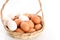 Duck and chicken eggs on the wooden basket