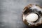 Duck eggs on a cage gray background.