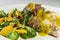 Duck legs with orange sauce and lamb`s lettuce salad with oranges and vinegar