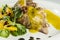 Duck legs with orange sauce and lamb`s lettuce salad with oranges and vinegar