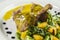 Duck legs with orange sauce and lamb`s lettuce salad with oranges and vinegar