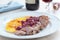 Duck meat with orange and cherry sauce