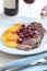 Duck meat with orange and cherry sauce