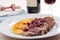 Duck meat with orange and cherry sauce