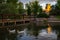 The Duck Pond on the University of New Mexico in Albuquerque, New Mexico campus with pond and bridge at sunset