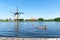 Duck swimming through a lake in Kinderdijk, the Netherlands