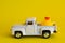 Duck on vintage pickup truck abstract minimal yellow background