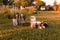 Ducks on the farm. Light and dark ducklings drink water from an iron trough.