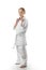 A duduka is standing in a kimano on a white background. Karate is insulated.