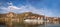 DUERNSTEIN CASTLE AND VILLAGE WITH BOAT ON DANUBE RIVER DURING AUTUMN TIME IN AUSTRIA