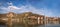 DUERNSTEIN CASTLE AND VILLAGE WITH BOAT ON DANUBE RIVER DURING AUTUMN TIME IN AUSTRIA