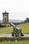 Dugald Stewart Monument and cannon on Calton hill, mountain in Edinburgh in east of Scotland
