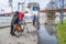 Duisburg Germany - January 08 2017 : Bike drivers surprised by the river Rhine flooding the promenade