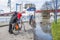 Duisburg Germany - January 08 2017 : Bike drivers surprised by the river Rhine flooding the promenade