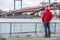 Duisburg , Germany - January 08 2017 : Tourist observing the the river Rhine flooding the promenade in Ruhrort