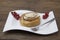 Dukan Diet. Fresh delicious diet cake at Dukan Diet on a porcelain plate with a spoon on a wooden background.