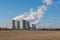 Dukovany Nuclear Power Plant in the Czech Republic, Europe. Smoke cooling towers. There are clouds in the sky. In the background