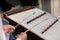 A dulcimer which Thai traditional music instrument. Man playing hammered dulcimer with mallets.