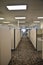 Dull empty office hallway in a cube farm with neutral colors