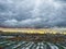 Dull suburban city landscape. Old garages and ruined industrial area of the city against the dramatic sky. An impending storm