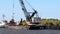 DULUTH, MN - 5 OCT 2020: Working crane on a floating dredging barge.