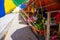 Dumaguete, the Philippines - 1 Jul 2021: Fruit market stall with fresh mango and avocado. Local farm market street under sun.