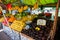 Dumaguete, the Philippines - 1 Jul 2021: Fruit market stall with fresh mango and avocado. Organic farm market in tropical Asia.