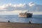 Dumaguete, the Philippines - 10 Mar 2020: cargo ferry in sea, view from port. Maritime shipping and delivery service