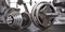 Dumbbell and barbell on the floor of gym. Close up fItness equipment. Sport, fitness and bodybuilding concept background