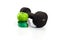 Dumbbell, green apple and measuring tape on a white background.