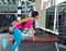 Dumbbell triceps kickback girl exercise at gym